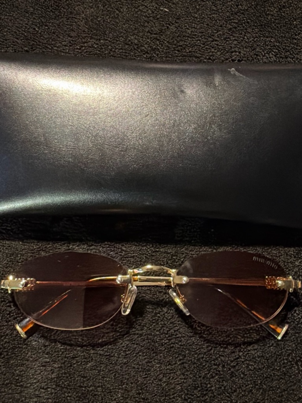 Miu miu Gold Rim Oval Sunglasses with Brown Lenses